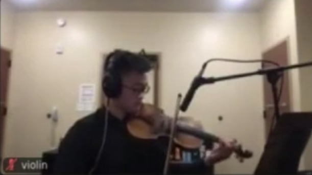 Stanford orchestra member using Jacktrip and recorded on Zoom